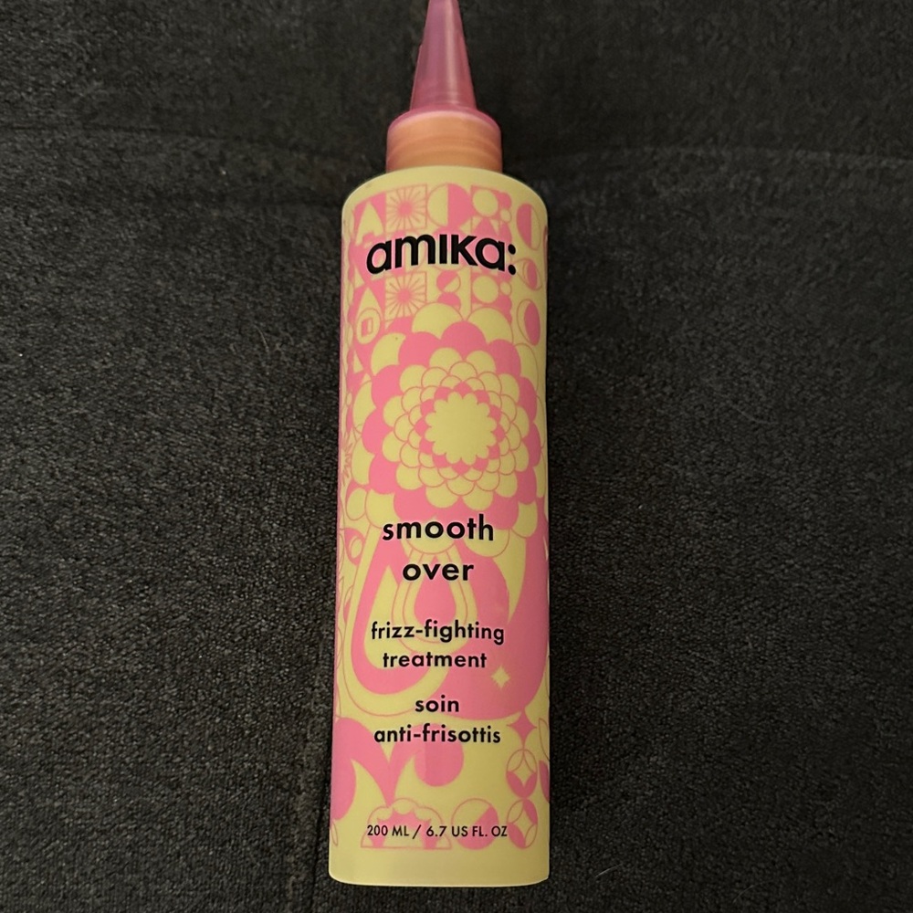Amika Smooth Over Frizz Treatment in Pink and Yellow